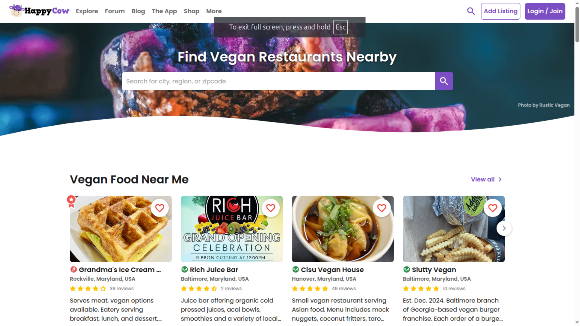 HappyCow website homepage showing search bar to find vegan restaurants nearby, featuring listings of plant based eateries and vegan food options in local areas 